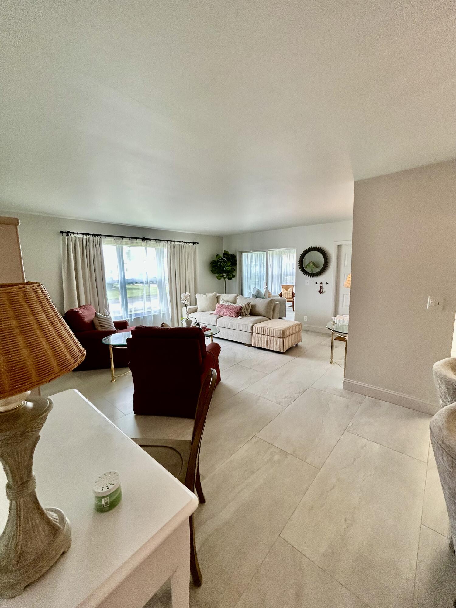 5289 Lake Front Boulevard, Unit D Delray Beach, FL 33484 - Photo 7 of 14 a living room with furniture and a window