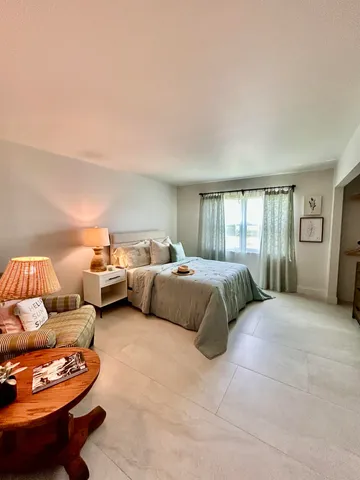 a bedroom with furniture and a couch