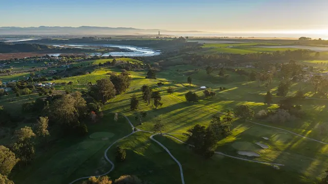 a view of backyard of house with green space