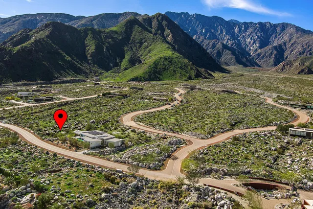 a view of a houses with a road