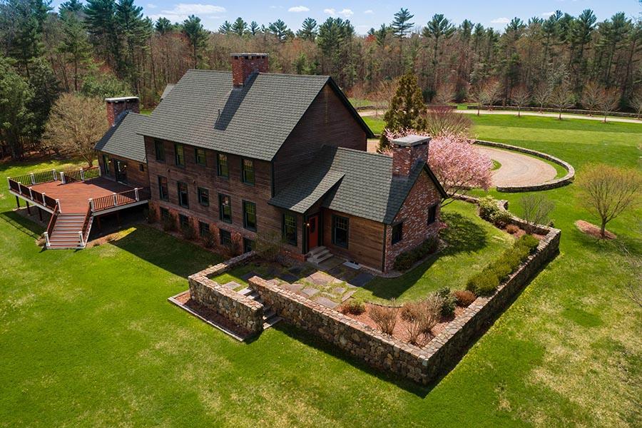 a view of a house with pool and a yard