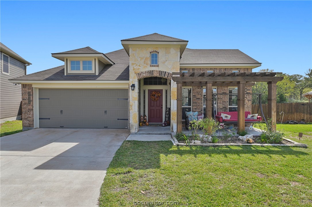 2025 Jester Trail Bryan, TX 77807 - Photo 1 of 1 a front view of house with yard