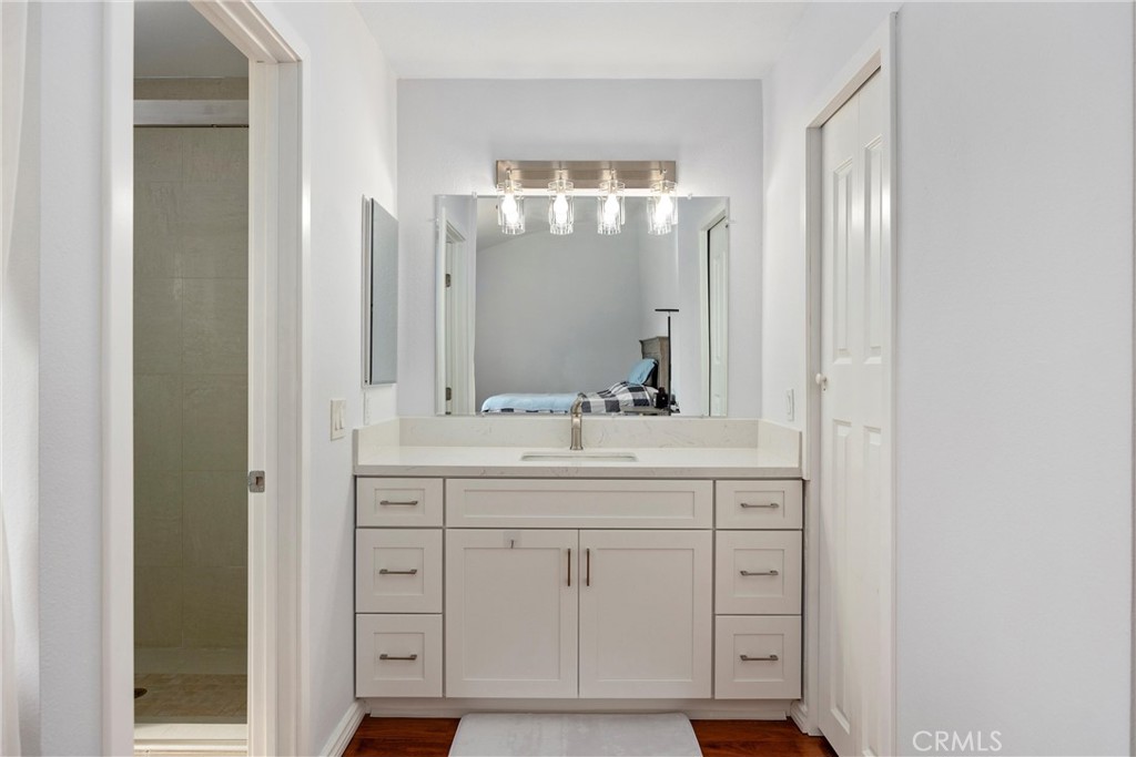 1415 Rolling Knoll Road Diamond Bar, CA 91765 - Photo 11 of 24 a bathroom with a double vanity sink and mirror