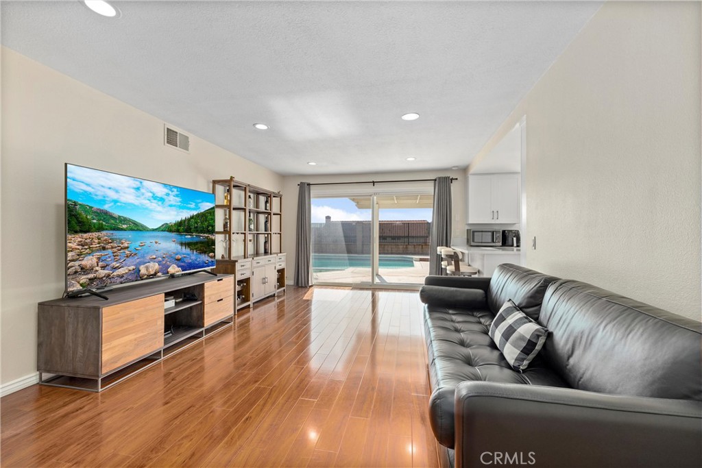 1415 Rolling Knoll Road Diamond Bar, CA 91765 - Photo 9 of 24 a living room with furniture and a flat screen tv