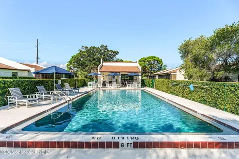 a view of a swimming pool with a patio