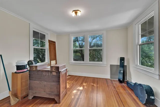 a living room with furniture and windows