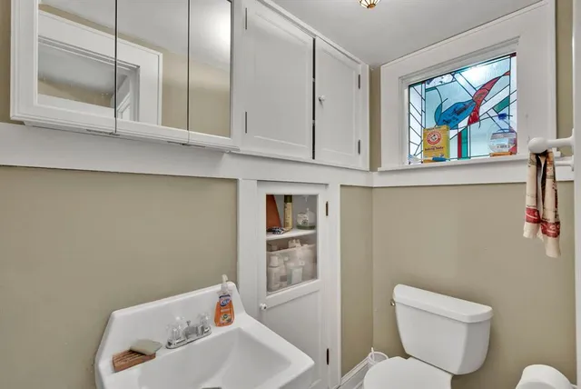 a bathroom with a toilet and a sink