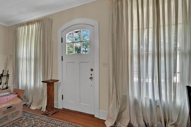 a view of entryway with wooden floor