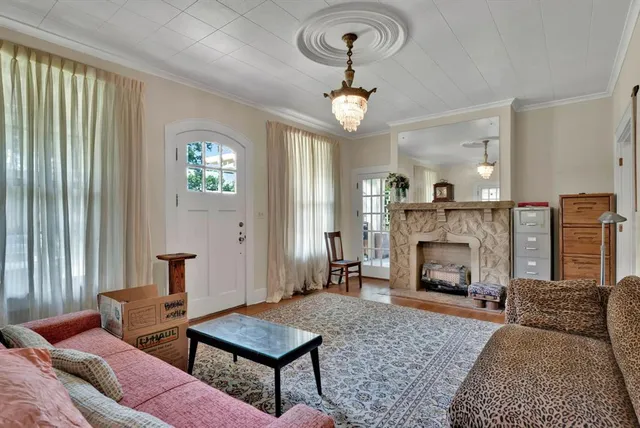 a living room with furniture and a fireplace