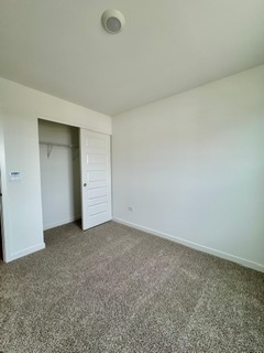 2136 Bodega Road, Unit 2136 Oswego, IL 60543 - Photo 16 of 19 an empty room with closet