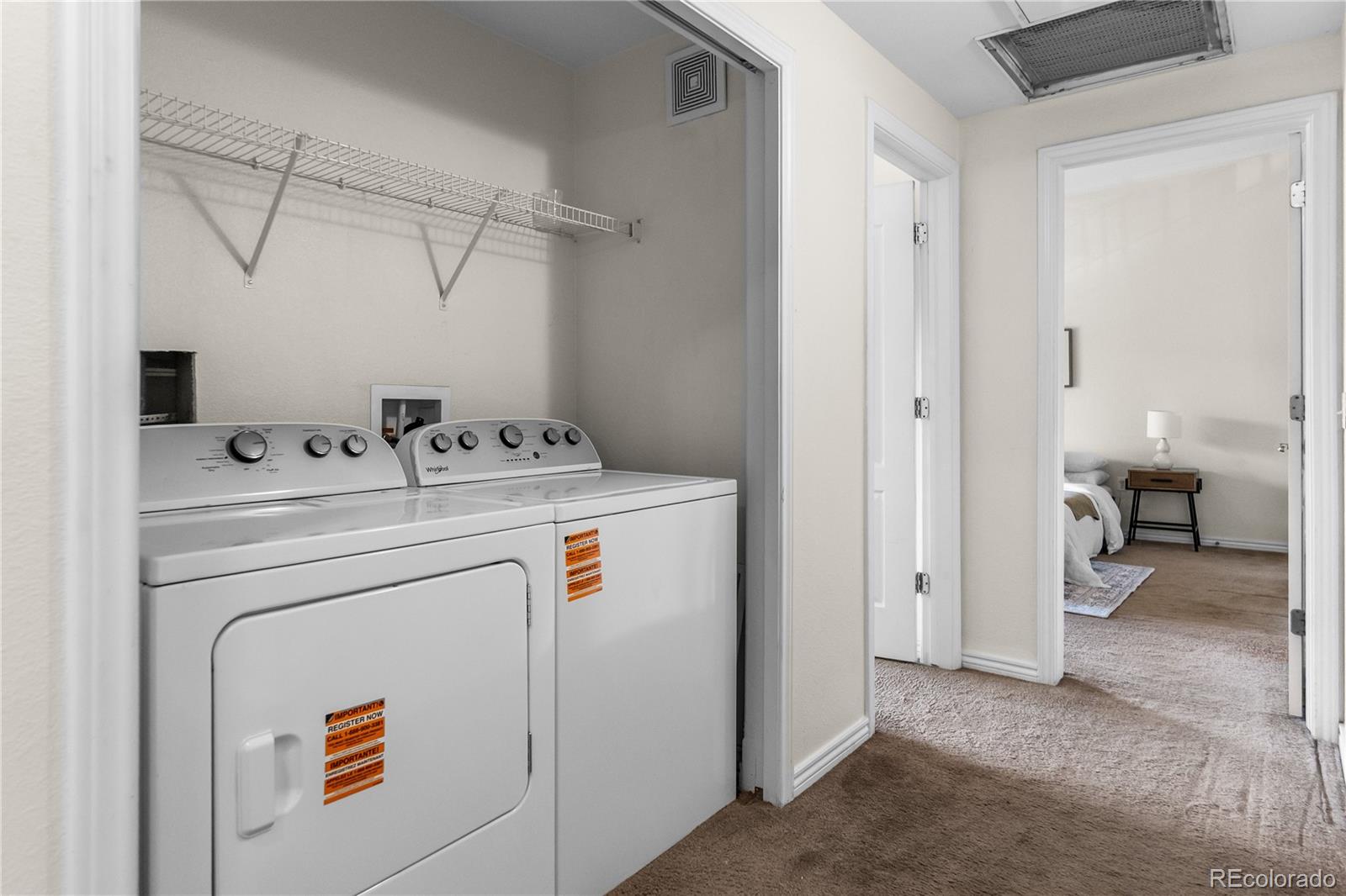 18669 Stroh Road, Unit 10204 Parker, CO 80134 - Photo 11 of 24 a utility room with dryer and washer