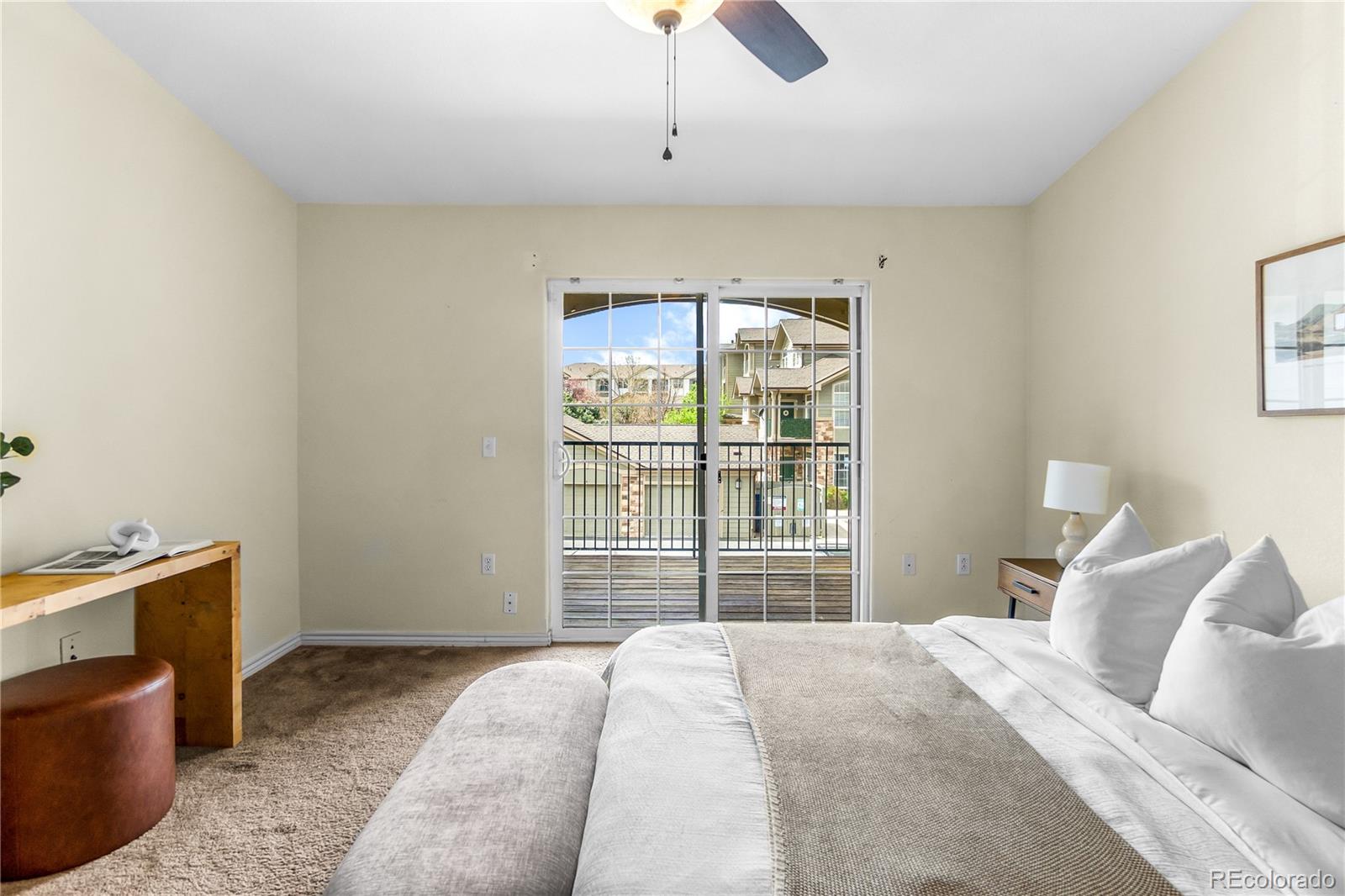 18669 Stroh Road, Unit 10204 Parker, CO 80134 - Photo 18 of 24 a bedroom with a bed and a television