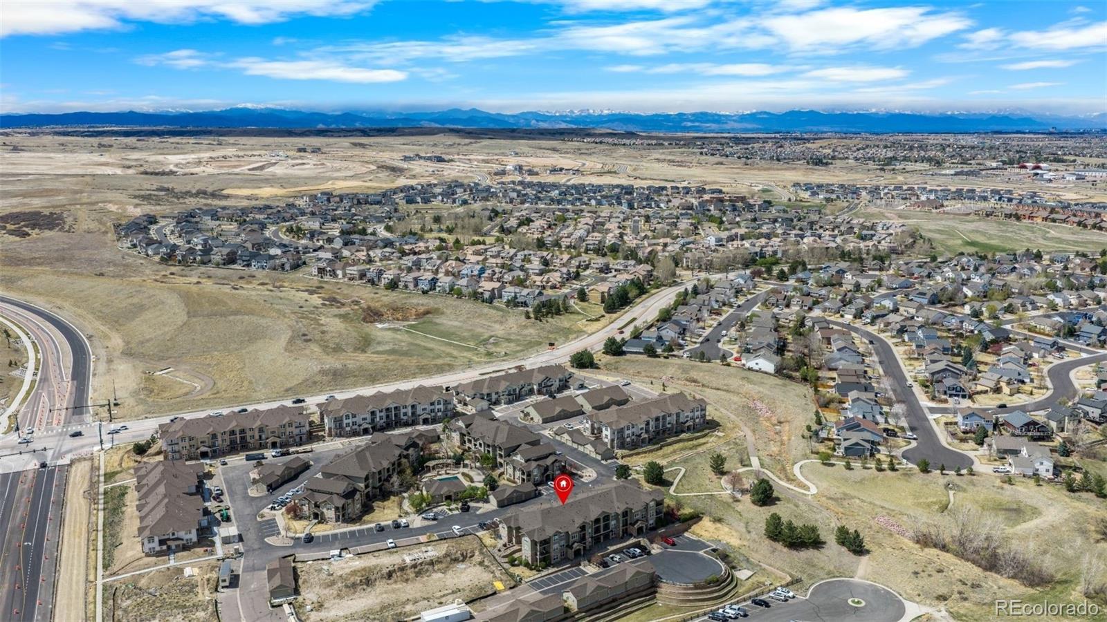 18669 Stroh Road, Unit 10204 Parker, CO 80134 - Photo 23 of 24 a view of a building with an ocean beach