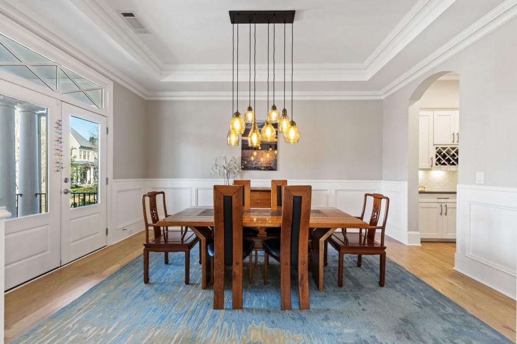 1105 Lee Street Milton, GA 30004 - Photo 11 of 47 a view of a dining room with furniture window and wooden floor