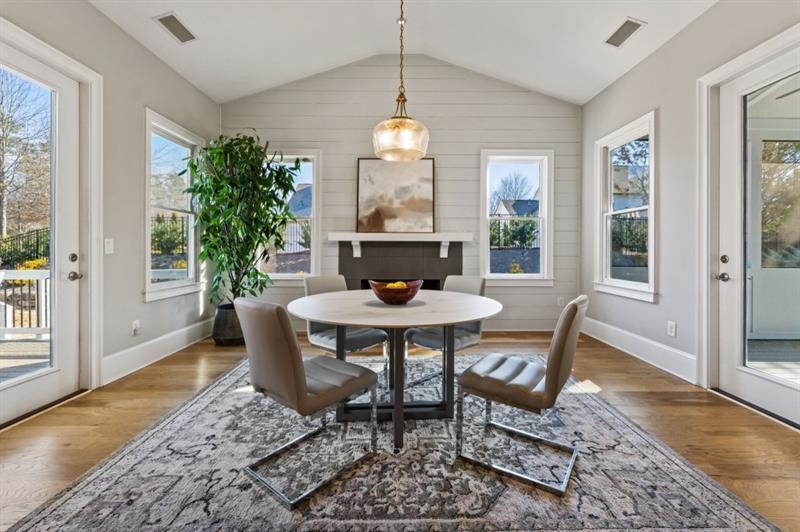 1105 Lee Street Milton, GA 30004 - Photo 18 of 47 a dining room with furniture a rug and a chandelier