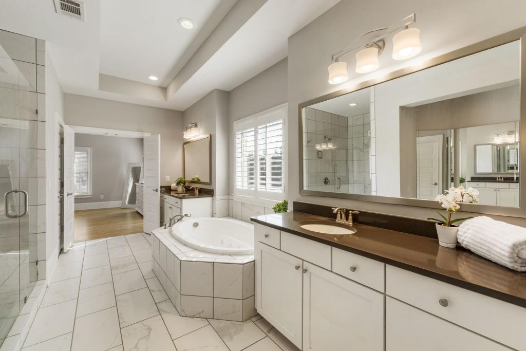 1105 Lee Street Milton, GA 30004 - Photo 26 of 47 a spacious bathroom with a double vanity sink a mirror and a bathtub