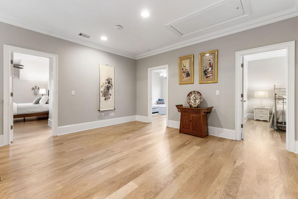1105 Lee Street Milton, GA 30004 - Photo 29 of 47 a living room with furniture and a wooden floor