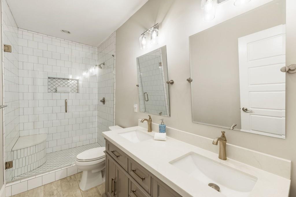 1105 Lee Street Milton, GA 30004 - Photo 41 of 47 a bathroom with a sink a toilet and shower
