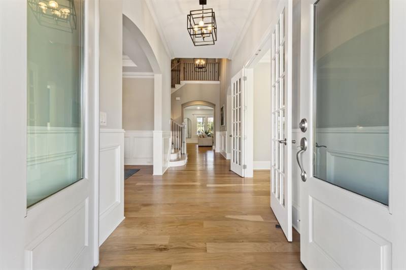 1105 Lee Street Milton, GA 30004 - Photo 8 of 47 a view of a hallway with wooden floor windows and livingroom