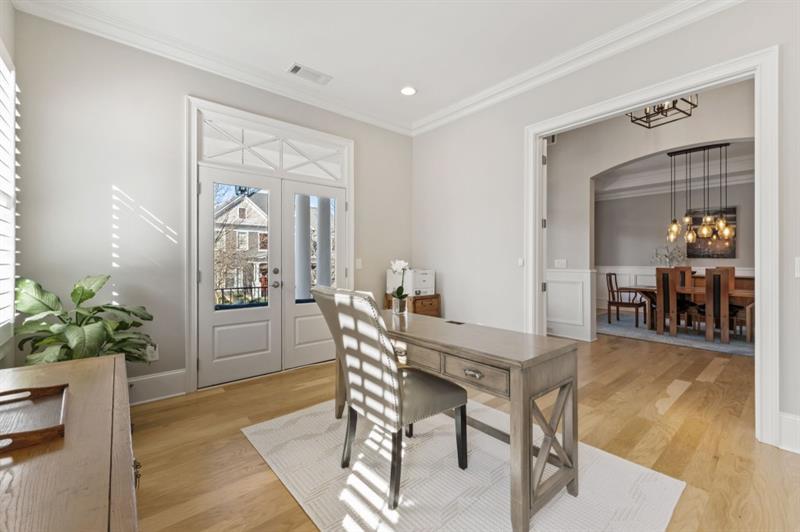 1105 Lee Street Milton, GA 30004 - Photo 10 of 47 a view of a dining room with furniture and wooden floor
