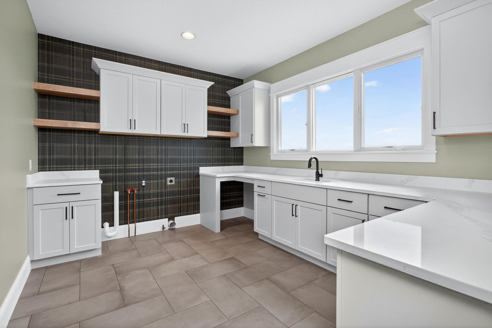 6928 Wilderness Pointe Bettendorf, IA 52722 - Photo 27 of 48 a kitchen with cabinets appliances and a sink