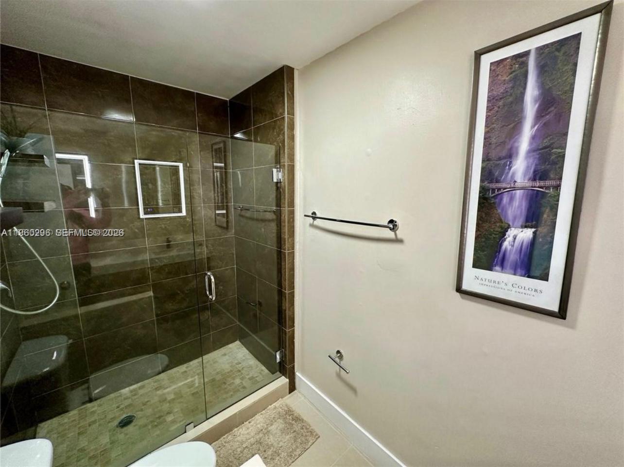 10640 Southwest 75th Lane Miami, FL 33173 - Photo 16 of 21 a bathroom with a shower