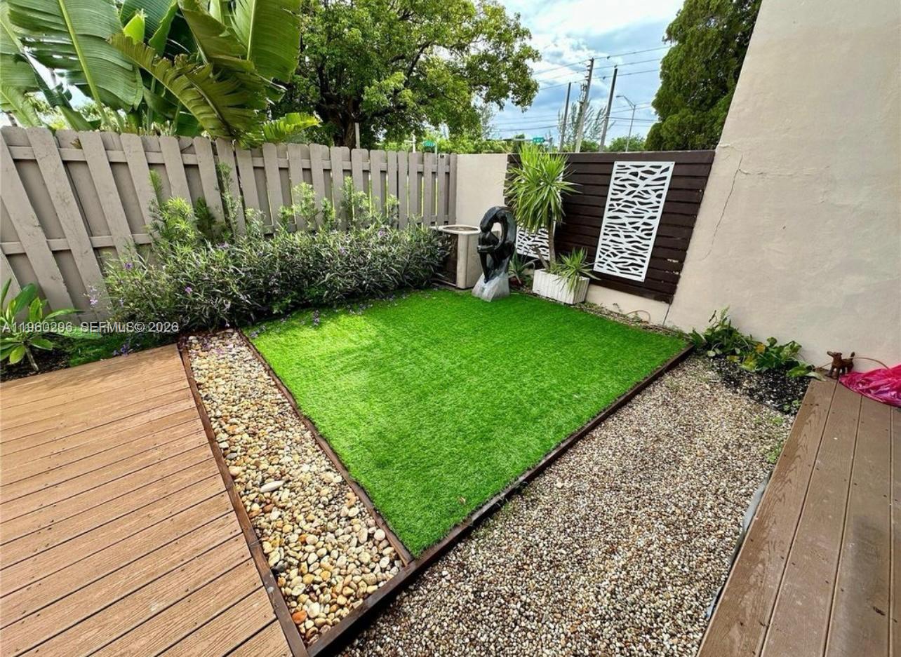 10640 Southwest 75th Lane Miami, FL 33173 - Photo 19 of 21 a view of a backyard with wooden fence