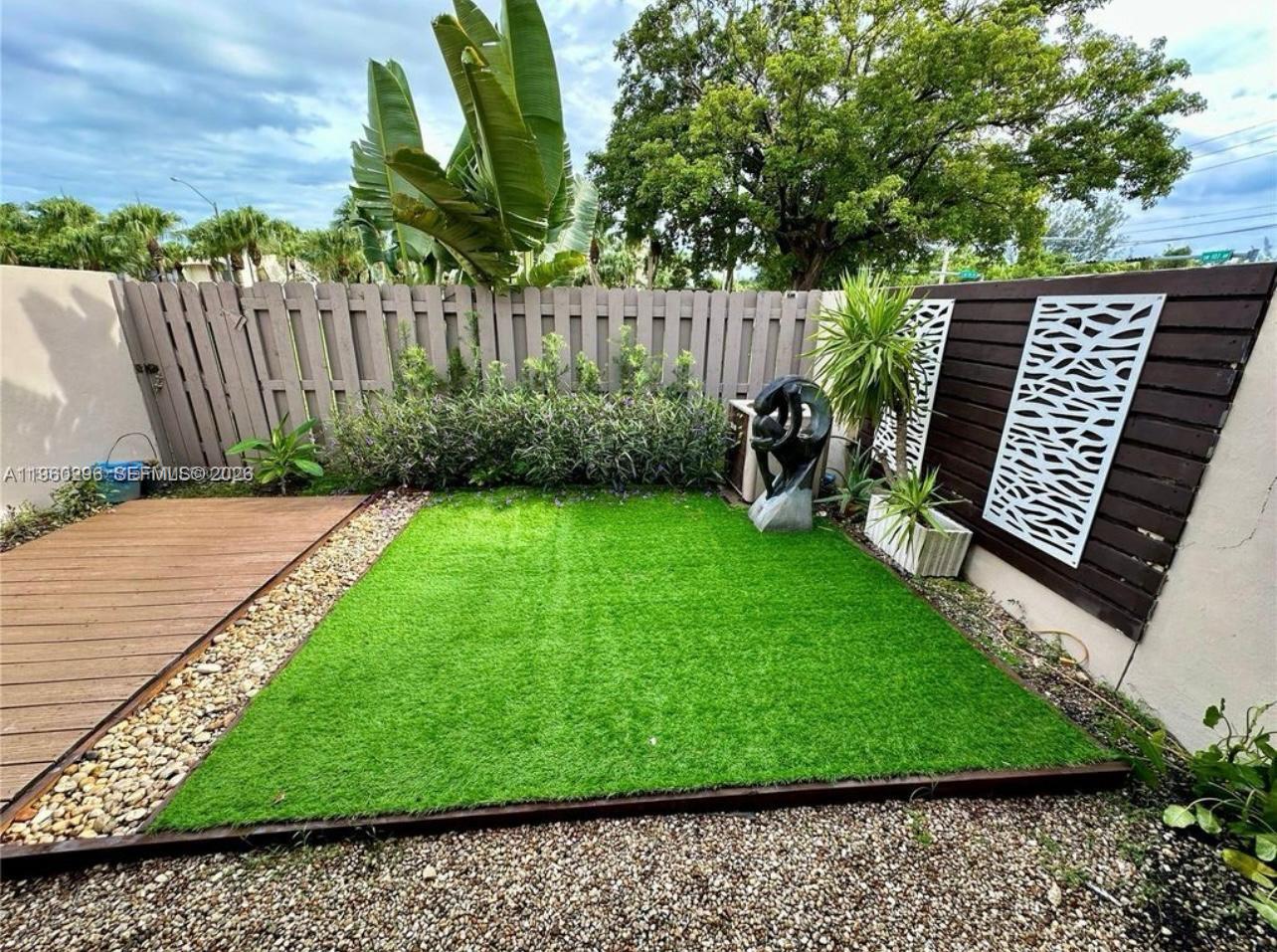 10640 Southwest 75th Lane Miami, FL 33173 - Photo 20 of 21 a view of a backyard with a garden