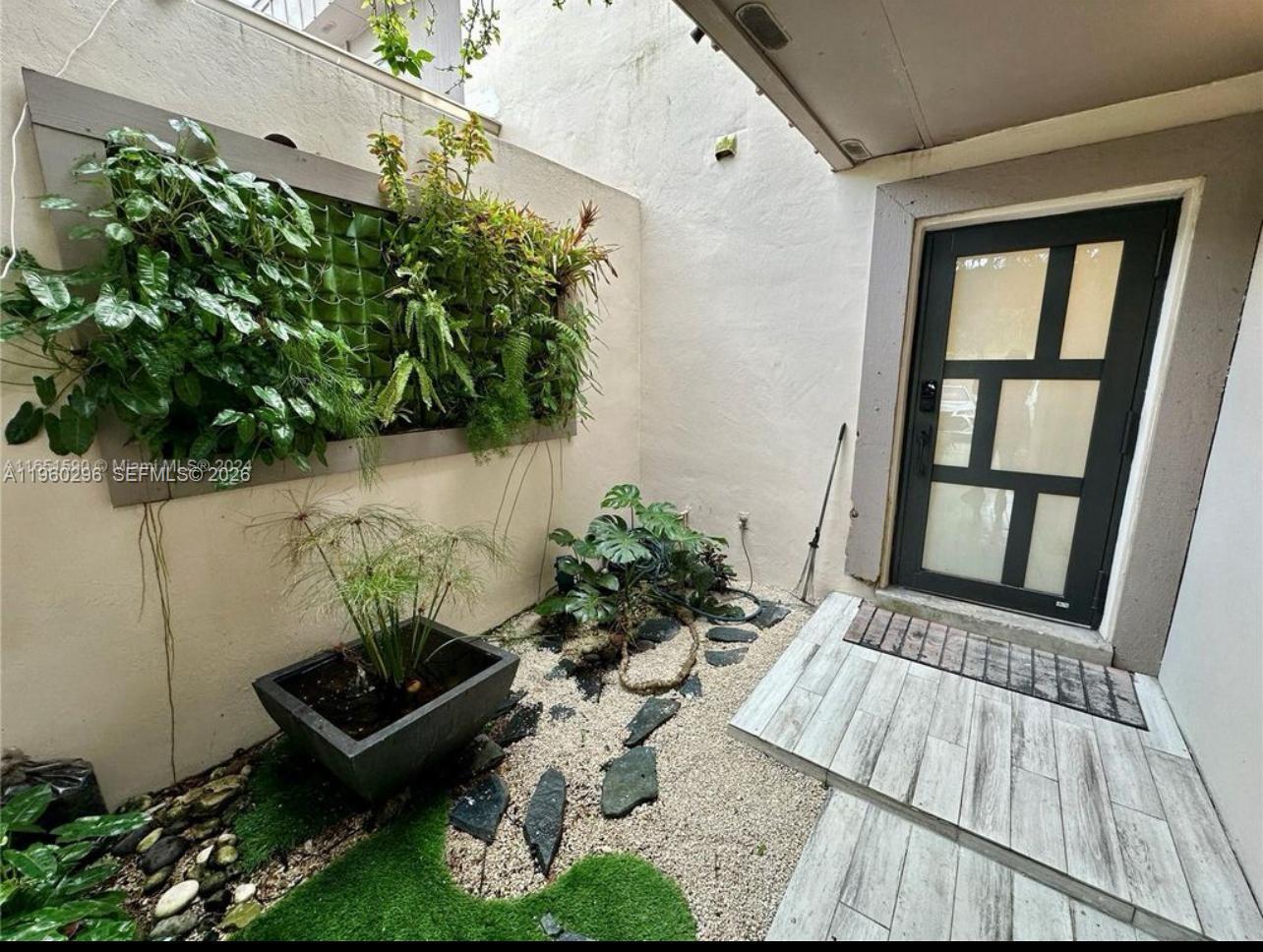 10640 Southwest 75th Lane Miami, FL 33173 - Photo 2 of 21 front view of a house with a yard