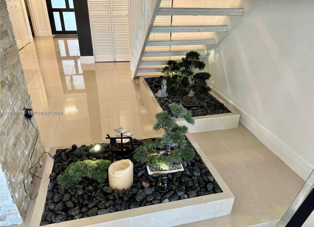 10640 Southwest 75th Lane Miami, FL 33173 - Photo 10 of 21 a bathroom with a sink and mirror