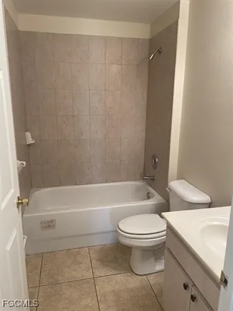 a bathroom with a toilet and a bath tub