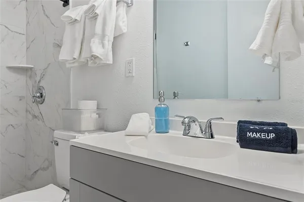 a bathroom with a sink and a toilet
