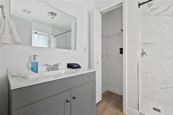 a bathroom with a sink and a mirror