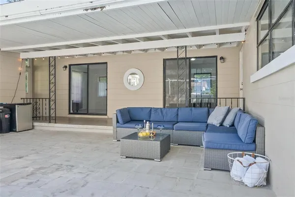 a living room with furniture and a large window