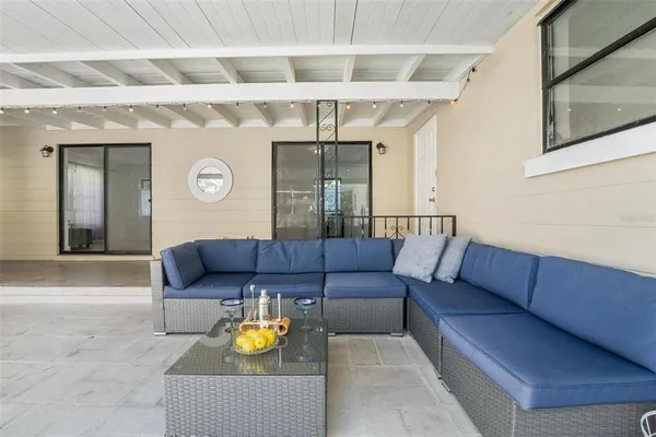 a living room with furniture and a window