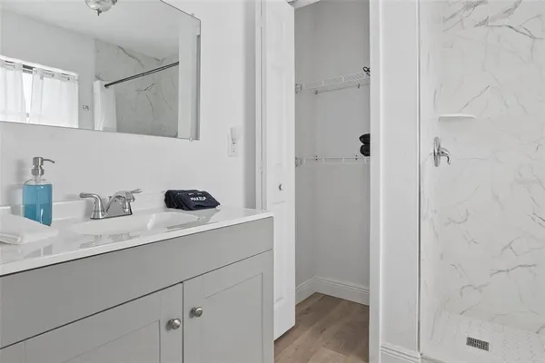 a kitchen with a sink and a refrigerator