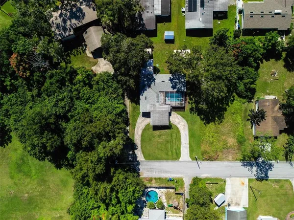 an aerial view of a house with a garden
