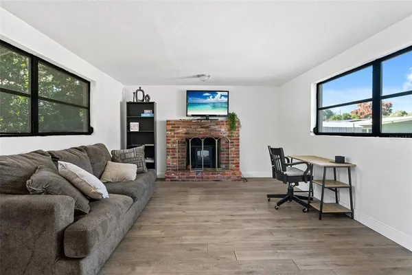 a living room with furniture and a fireplace