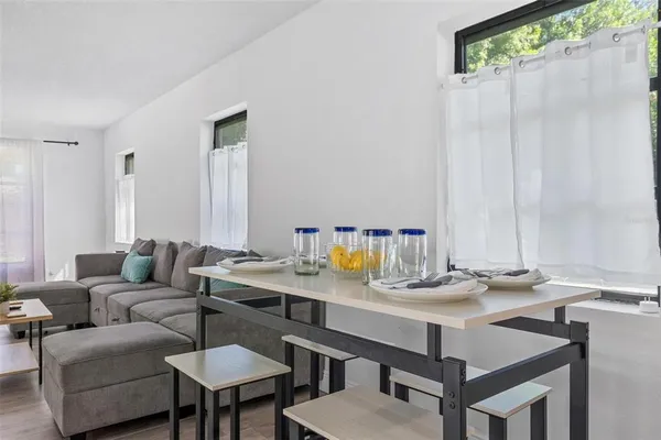 a living room with furniture and a table