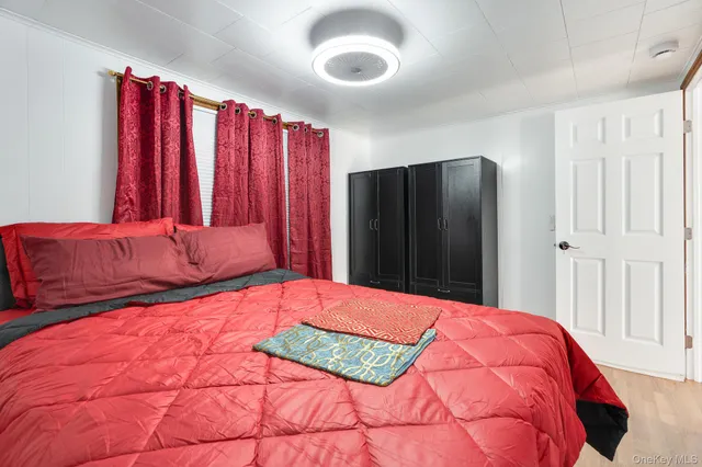 a bedroom with a large bed and a closet