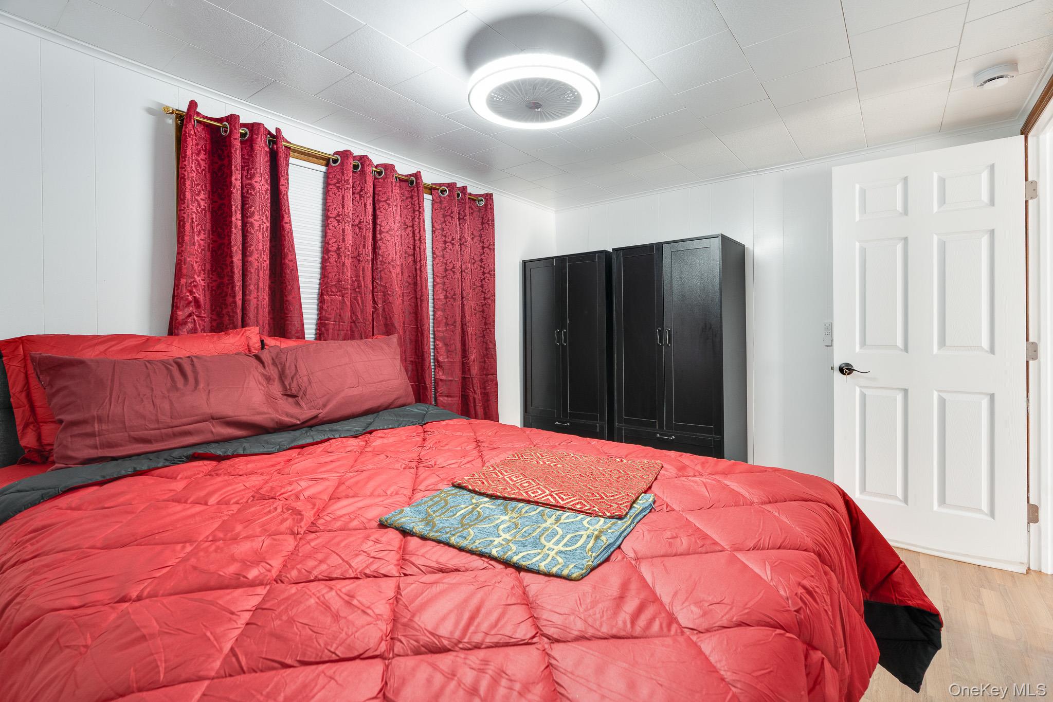 49 Delafield Street, Unit 1 Poughkeepsie, NY 12601 - Photo 16 of 24 a bedroom with a large bed and a closet