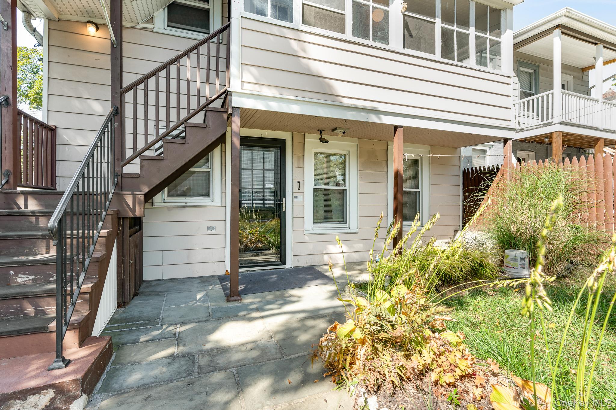 49 Delafield Street, Unit 1 Poughkeepsie, NY 12601 - Photo 4 of 24 a front view of a house with a garden