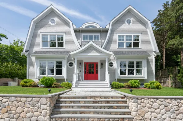 a front view of a house with garden