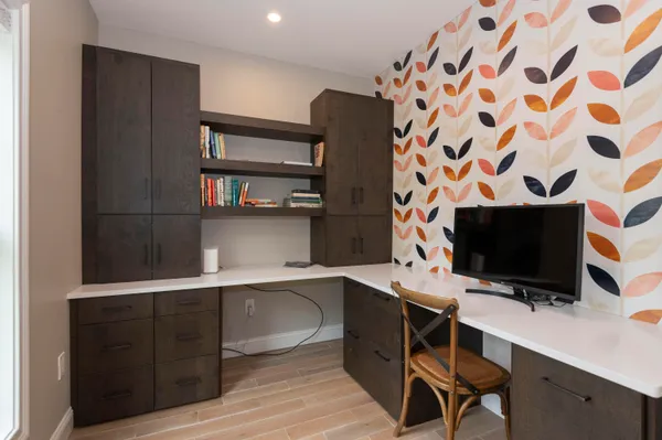 a view of a workspace with furniture