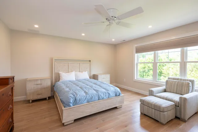 a bedroom with a bed and a couch