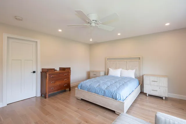 a bedroom with a bed and a dresser