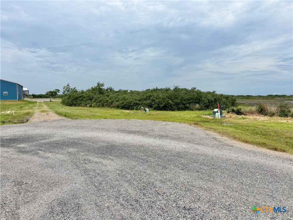 9 Boca Grande Loop Port O'Connor, TX 77982 - Photo 43 of 44 a view of a golf course with a lake