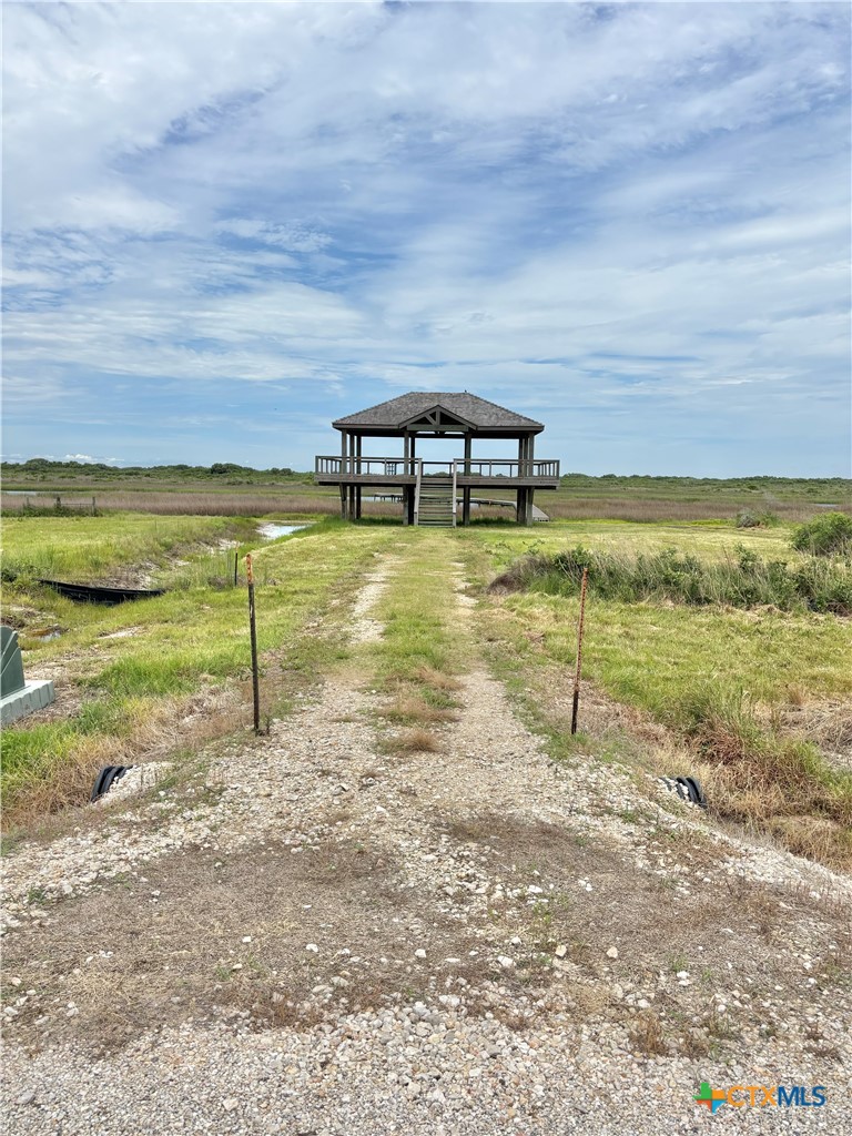 9 Boca Grande Loop Port O'Connor, TX 77982 - Photo 5 of 44 a view of a lake with a building in the background