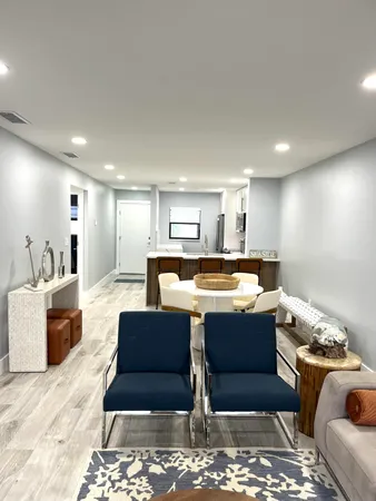 a kitchen with stainless steel appliances a refrigerator sink and microwave