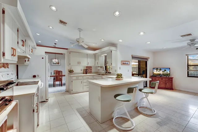 a kitchen with furniture and a table